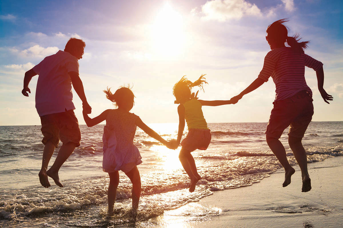 benefits-happy-beach-family R Happy employee family enjoying vacation